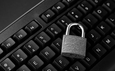 A high angle shot of a lock on a black computer keyboard